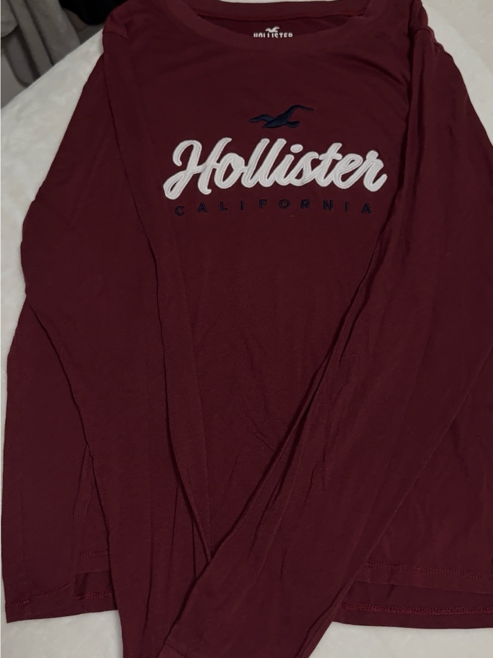 Hollister Maroon Long Sleeve Tee with White Script and Navy Icon